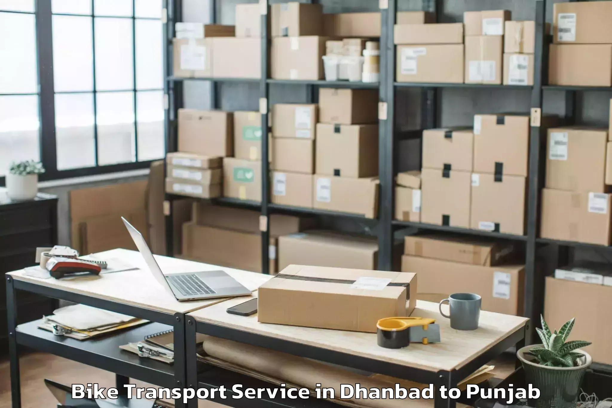 Book Dhanbad to Maharaja Ranjit Singh Punjab T Bike Transport Online